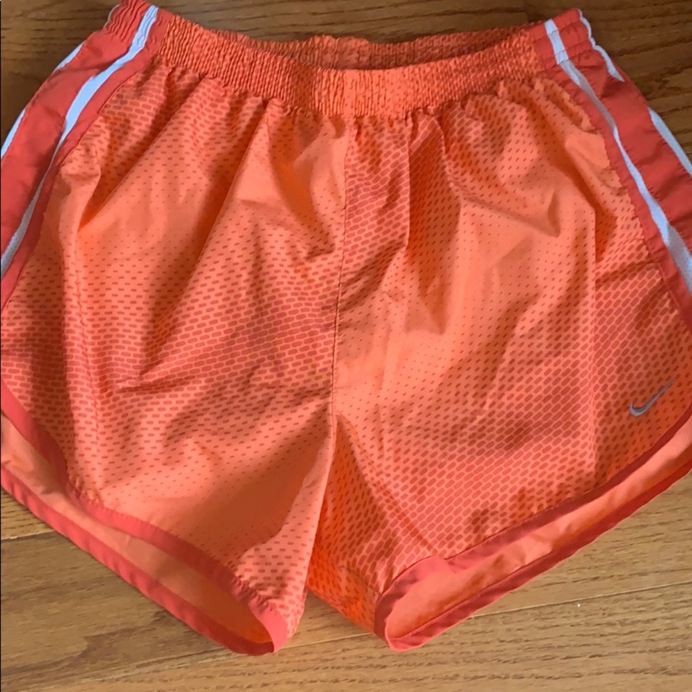 Orange patterned Nike shorts